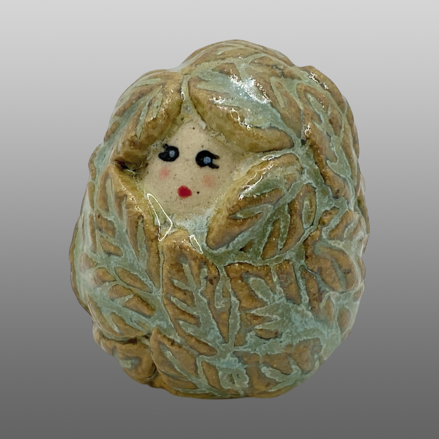 Poupée feuillage verte mini