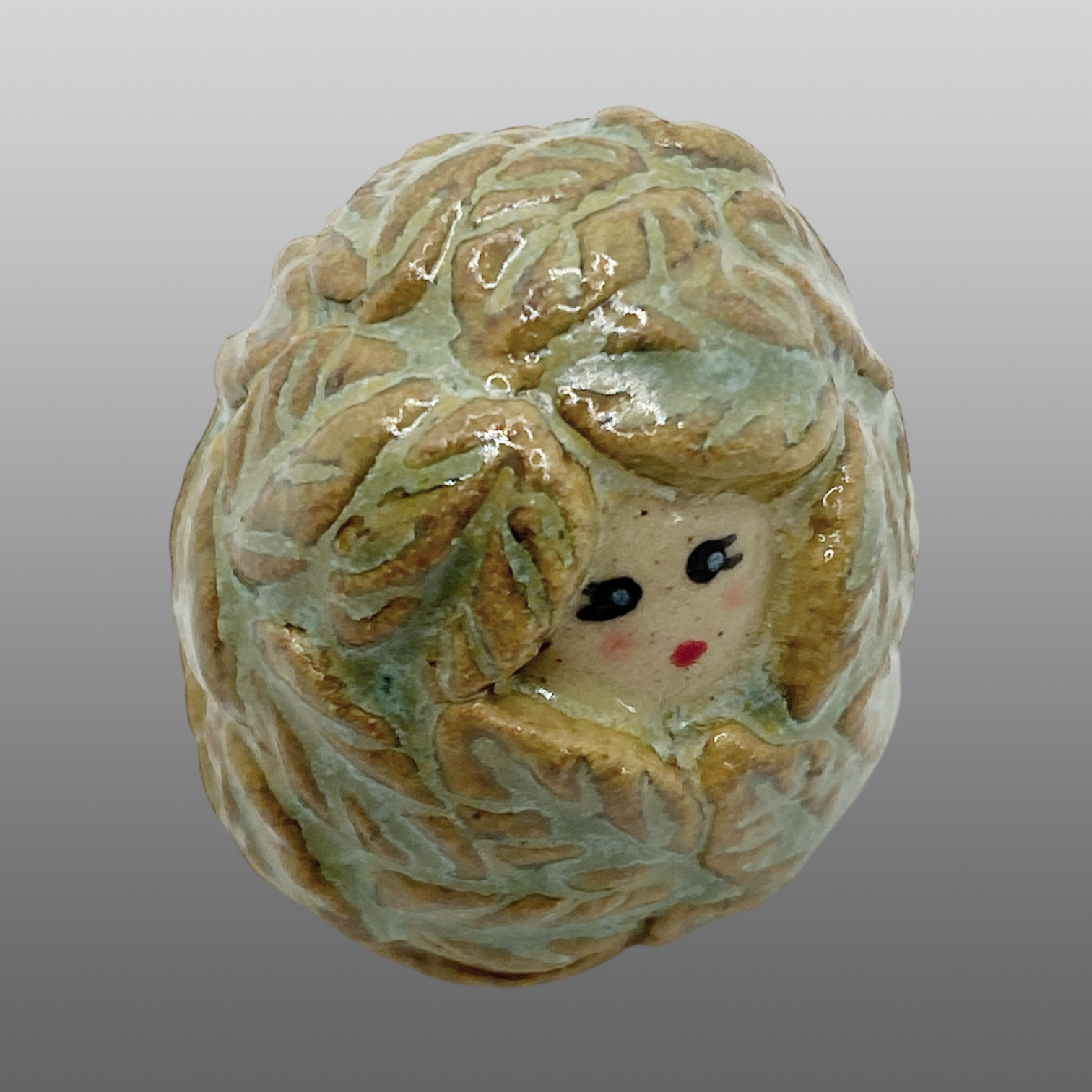 Poupée feuillage verte mini