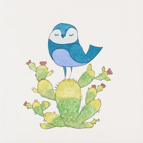 Oiseau bleu sur un cactus