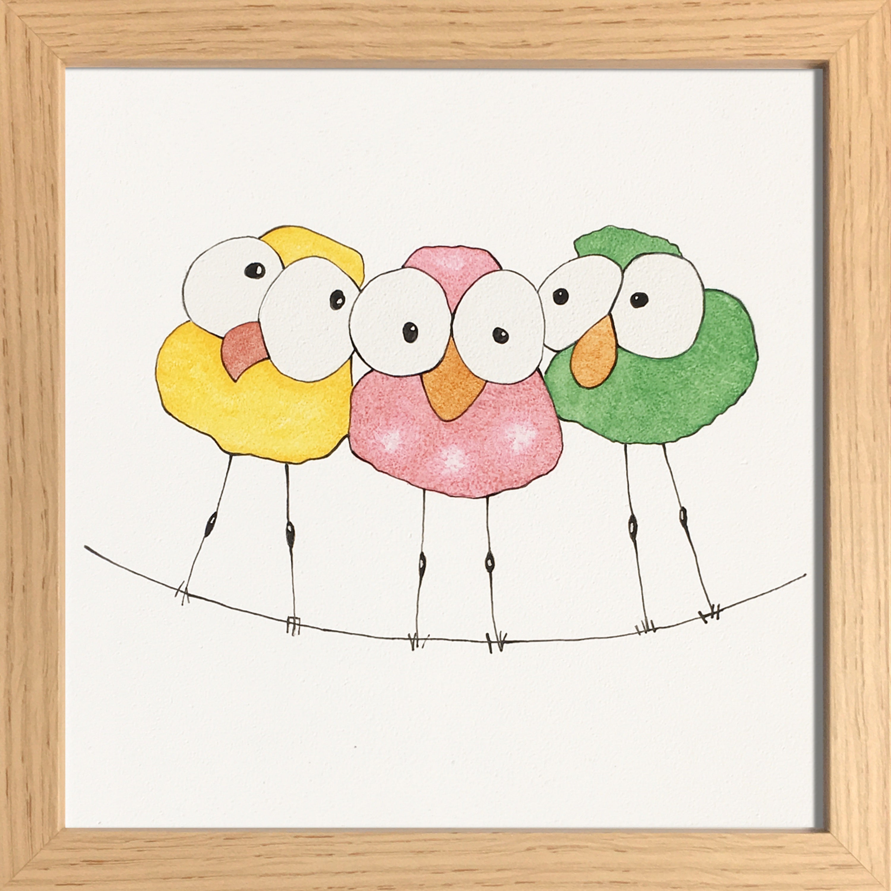 Trio d’oiseaux sur un fil