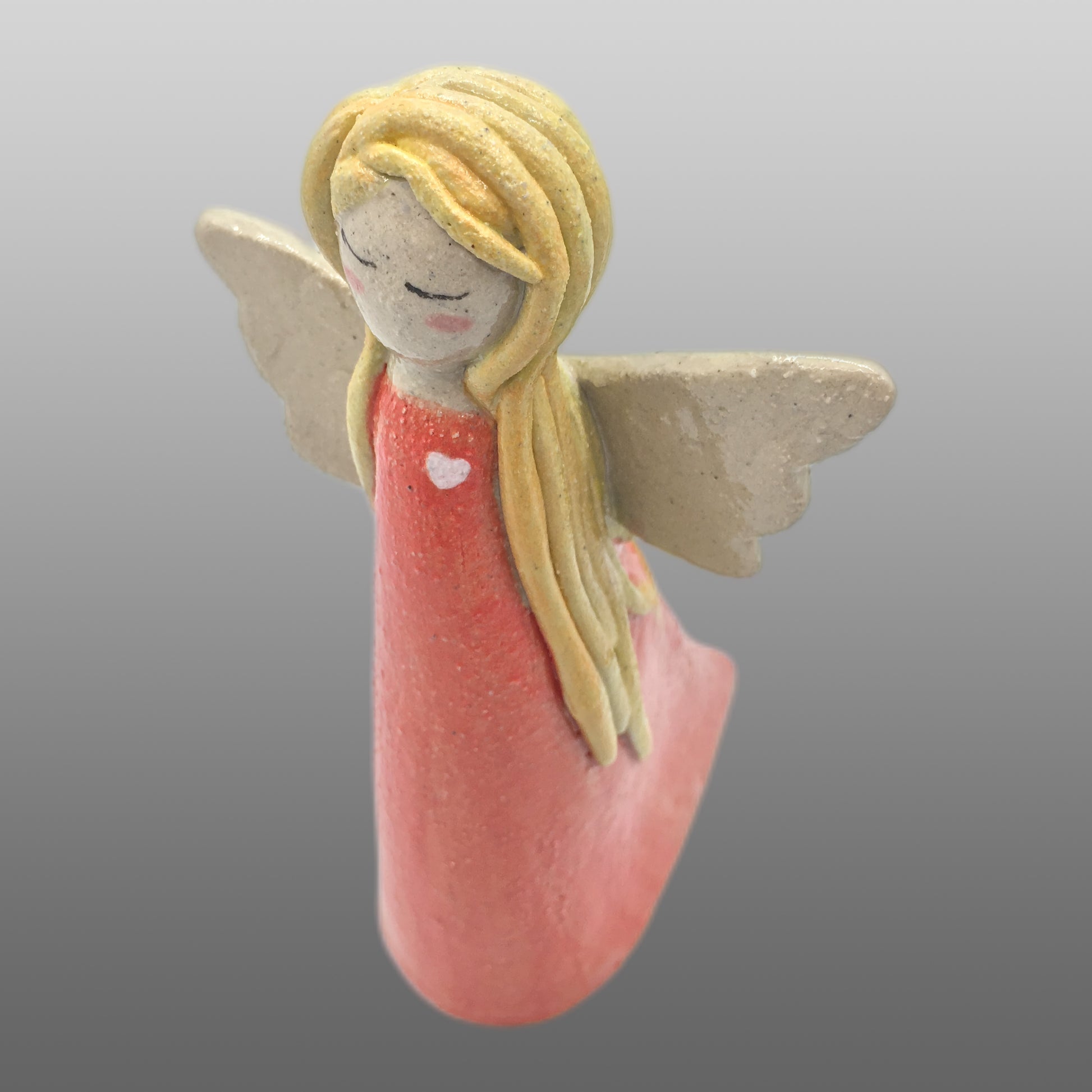 Ange fée cheveux blonds robe corail